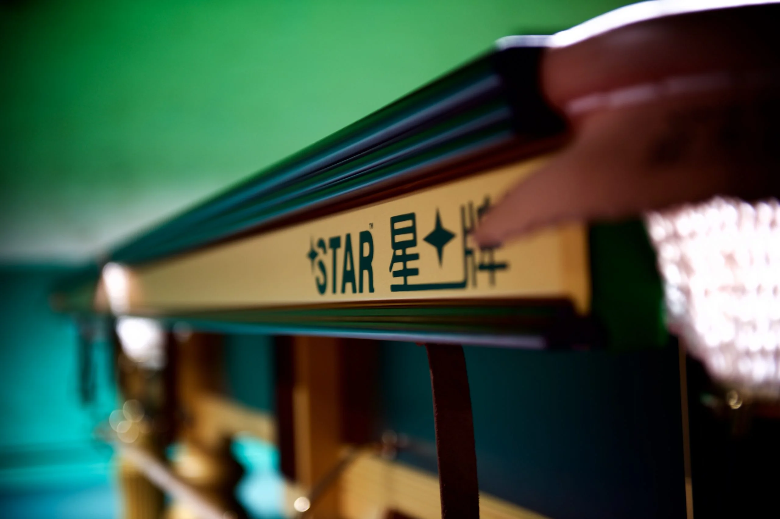 Close-up of a Star table rail and its STAR plaque